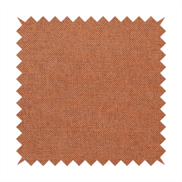 A finely textured weave in a bright ginger, amber, or light rust shade. The material features a subtle heathered look with finely blended threads of warm orange and darker neutral undertones throughout.