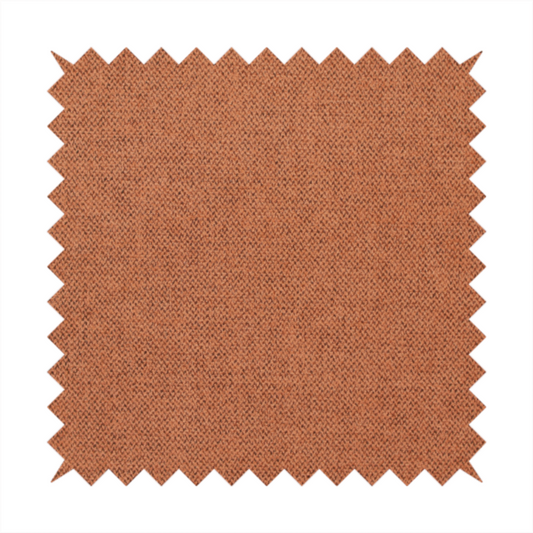 A finely textured weave in a bright ginger, amber, or light rust shade. The material features a subtle heathered look with finely blended threads of warm orange and darker neutral undertones throughout.