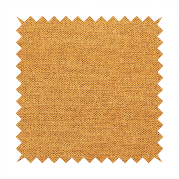 A finely textured weave in a rich mustard yellow or golden-amber shade. The material features a subtle heathered look with finely blended threads of warm yellow and darker neutral undertones throughout.