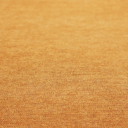 A finely textured weave in a rich mustard yellow or golden-amber shade. The material features a subtle heathered look with finely blended threads of warm yellow and darker neutral undertones throughout.