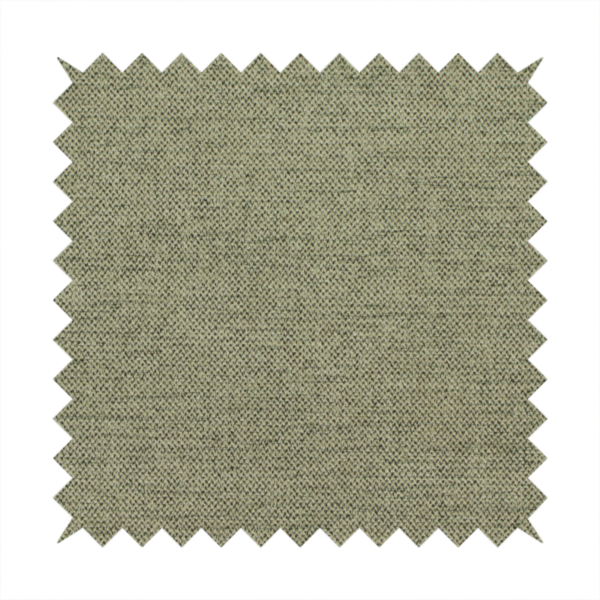 A finely textured weave in a muted sage, olive, or light moss green shade. The material features a subtle heathered look with finely blended threads of earthy green and darker neutral undertones throughout.