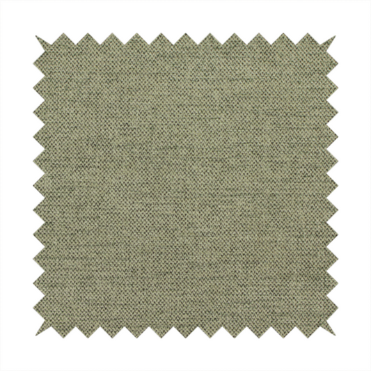 A finely textured weave in a muted sage, olive, or light moss green shade. The material features a subtle heathered look with finely blended threads of earthy green and darker neutral undertones throughout.