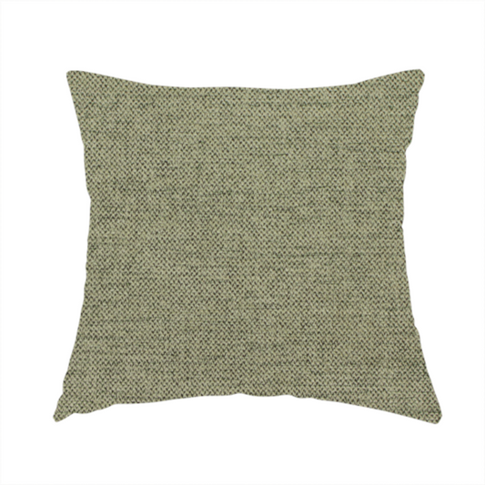 The fabric used to create this handmade cushion is a finely textured weave in a muted sage, olive, or light moss green shade. The material features a subtle heathered look with finely blended threads of earthy green and darker neutral undertones throughout.