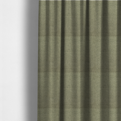 The fabric used to create these made-to-measure curtains is a finely textured weave in a muted sage, olive, or light moss green shade. The material features a subtle heathered look with finely blended threads of earthy green and darker neutral undertones throughout.