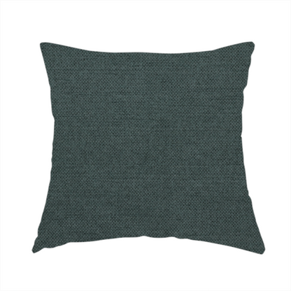 The fabric used to create this handmade cushion is a finely textured weave in a deep teal, slate green, or dark spruce shade. The material features a subtle heathered look with finely blended threads of rich blue-green and darker neutral undertones throughout.