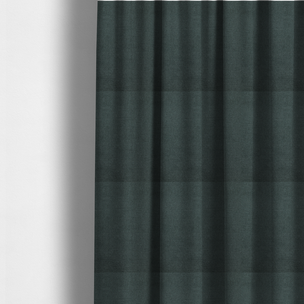The fabric used to create these made-to-measure curtains is a finely textured weave in a deep teal, slate green, or dark spruce shade. The material features a subtle heathered look with finely blended threads of rich blue-green and darker neutral undertones throughout.