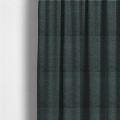 The fabric used to create these made-to-measure curtains is a finely textured weave in a deep teal, slate green, or dark spruce shade. The material features a subtle heathered look with finely blended threads of rich blue-green and darker neutral undertones throughout.