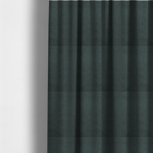 The fabric used to create these made-to-measure curtains is a finely textured weave in a deep teal, slate green, or dark spruce shade. The material features a subtle heathered look with finely blended threads of rich blue-green and darker neutral undertones throughout.