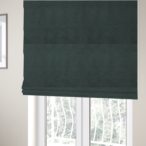 The fabric used to create these Roman blinds is a finely textured weave in a deep teal, slate green, or dark spruce shade. The material features a subtle heathered look with finely blended threads of rich blue-green and darker neutral undertones throughout.
