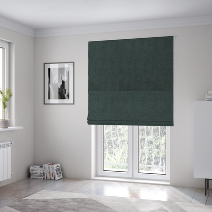 The fabric used to create these Roman blinds is a finely textured weave in a deep teal, slate green, or dark spruce shade. The material features a subtle heathered look with finely blended threads of rich blue-green and darker neutral undertones throughout.