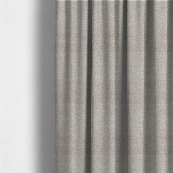 The fabric used to create these made-to-measure curtains is a finely textured weave in a pale silver, heather grey, or light ash tone. The material features a subtle heathered look with finely blended threads of cool grey and white undertones throughout.