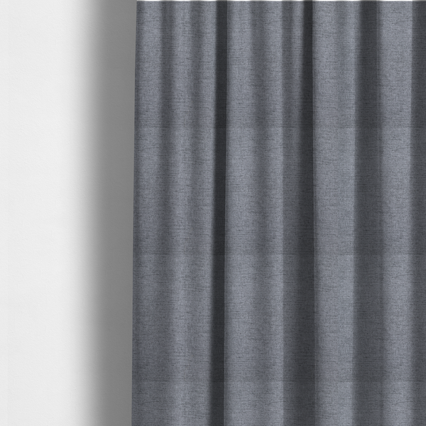 The fabric used to create these made-to-measure curtains is a finely textured weave in a medium steel grey or slate grey shade. The material features a subtle heathered look with finely blended threads of cool grey, soft charcoal, and muted blue-grey tones throughout.
