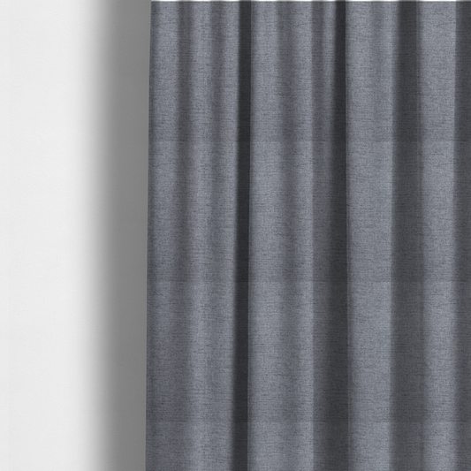 The fabric used to create these made-to-measure curtains is a finely textured weave in a medium steel grey or slate grey shade. The material features a subtle heathered look with finely blended threads of cool grey, soft charcoal, and muted blue-grey tones throughout.