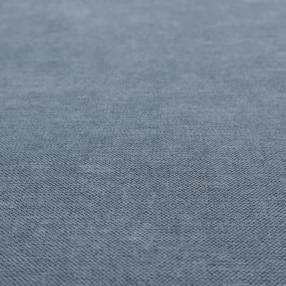 A finely textured weave in a soft denim, slate blue, or pigeon blue shade. The material features a subtle heathered look with finely blended threads of muted blue and cool grey undertones throughout.