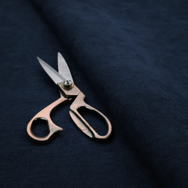 A finely textured, tight weave in a deep navy or midnight blue shade. The material features a subtle, uniform micro-textured look with very dark neutral undertones throughout.