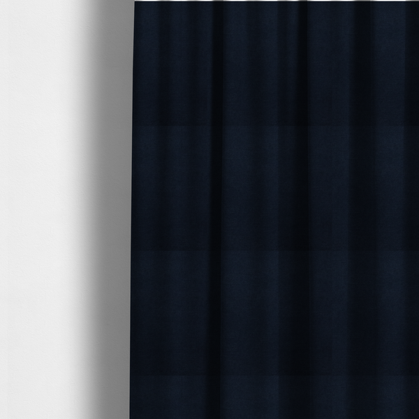 The fabric used to create these made-to-measure curtains is a finely textured, tight weave in a deep navy or midnight blue shade. The material features a subtle, uniform micro-textured look with very dark neutral undertones throughout.