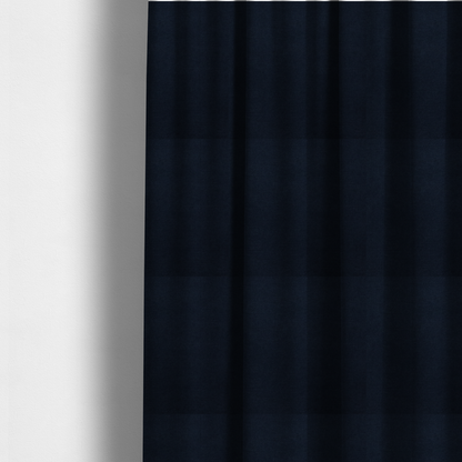 The fabric used to create these made-to-measure curtains is a finely textured, tight weave in a deep navy or midnight blue shade. The material features a subtle, uniform micro-textured look with very dark neutral undertones throughout.