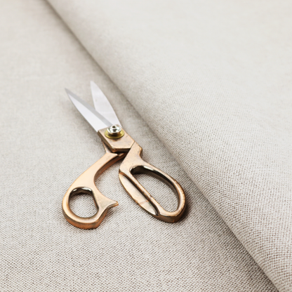 A finely textured weave in a pale cream, ivory, or oatmeal shade. The material features a subtle heathered look with finely blended threads of soft white and light neutral beige undertones throughout.