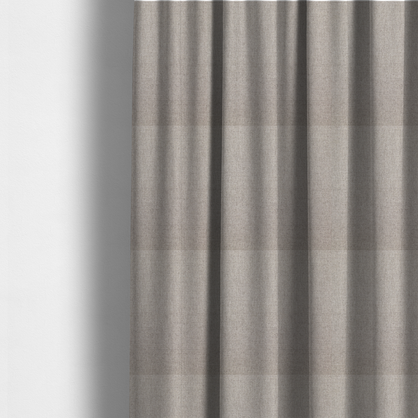 The fabric used to create these made-to-measure curtains is a finely textured weave in a light greige, taupe, or soft pebble grey shade. The material features a subtle heathered look with finely blended threads of cool grey and warm beige undertones throughout.