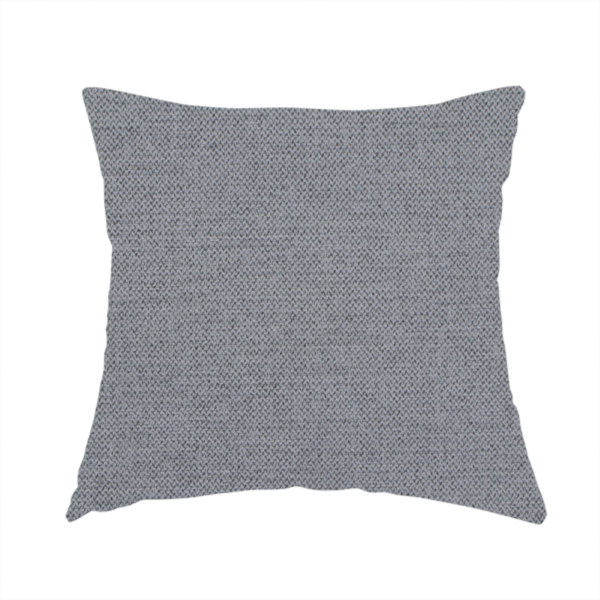 The fabric used to create this handmade cushion is a  finely textured weave in a medium mineral grey or cool slate shade. The material features a subtle heathered look with finely blended threads of classic grey, white, and faint charcoal undertones throughout.