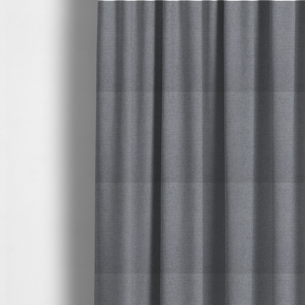 The fabric used to create these made-to-measure curtains is a finely textured weave in a medium mineral grey or cool slate shade. The material features a subtle heathered look with finely blended threads of classic grey, white, and faint charcoal undertones throughout.