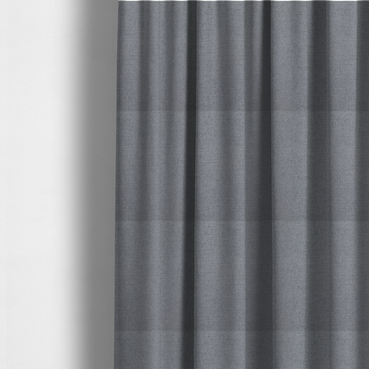 The fabric used to create these made-to-measure curtains is a finely textured weave in a medium mineral grey or cool slate shade. The material features a subtle heathered look with finely blended threads of classic grey, white, and faint charcoal undertones throughout.