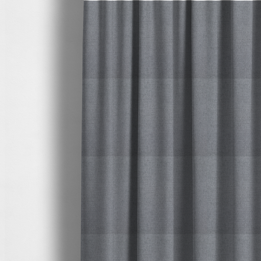 The fabric used to create these made-to-measure curtains is a finely textured weave in a medium mineral grey or cool slate shade. The material features a subtle heathered look with finely blended threads of classic grey, white, and faint charcoal undertones throughout.