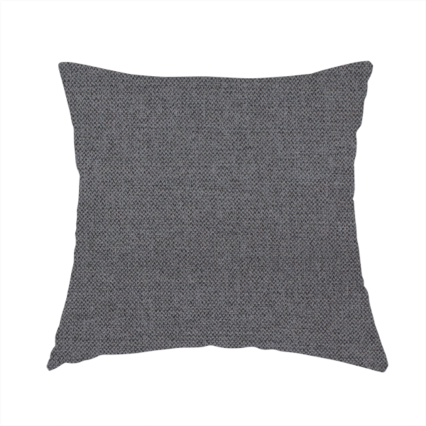 The fabric used to create this handmade cushion is a finely textured weave in a deep charcoal, graphite, or dark slate grey shade. The material features a subtle heathered look with finely blended threads of black, deep grey, and soft ash undertones throughout.
