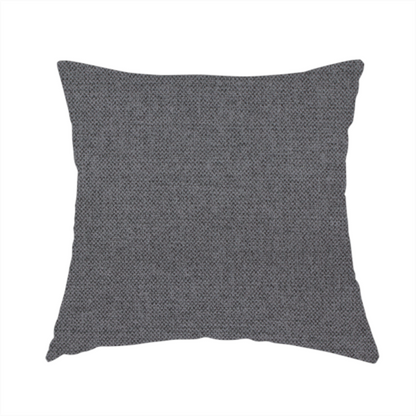 The fabric used to create this handmade cushion is a finely textured weave in a deep charcoal, graphite, or dark slate grey shade. The material features a subtle heathered look with finely blended threads of black, deep grey, and soft ash undertones throughout.