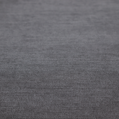A finely textured weave in a deep charcoal, graphite, or dark slate grey shade. The material features a subtle heathered look with finely blended threads of black, deep grey, and soft ash undertones throughout.