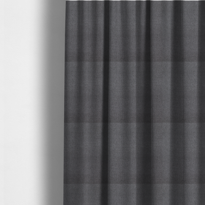 The fabric used to create these made-to-measure curtains is a finely textured weave in a deep charcoal, graphite, or dark slate grey shade. The material features a subtle heathered look with finely blended threads of black, deep grey, and soft ash undertones throughout.