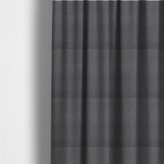 The fabric used to create these made-to-measure curtains is a finely textured weave in a deep charcoal, graphite, or dark slate grey shade. The material features a subtle heathered look with finely blended threads of black, deep grey, and soft ash undertones throughout.