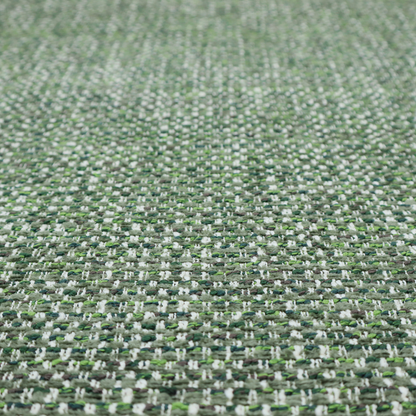 The material features a dense, multi-toned green tweed pattern, intricately interlaced with small flecks of white, bright lime green, and dark brown threads throughout.