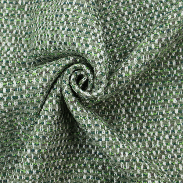 The material features a dense, multi-toned green tweed pattern, intricately interlaced with small flecks of white, bright lime green, and dark brown threads throughout.
