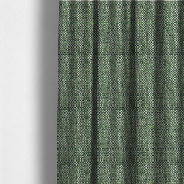 The fabric used to create these made-to-measure curtains is a material features a dense, multi-toned green tweed pattern, intricately interlaced with small flecks of white, bright lime green, and dark brown threads throughout.