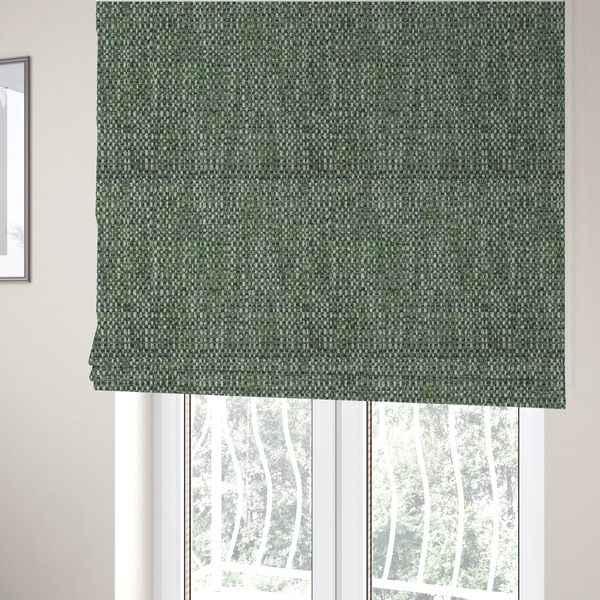 The fabric used to create these Roman blinds is a material features a dense, multi-toned green tweed pattern, intricately interlaced with small flecks of white, bright lime green, and dark brown threads throughout.