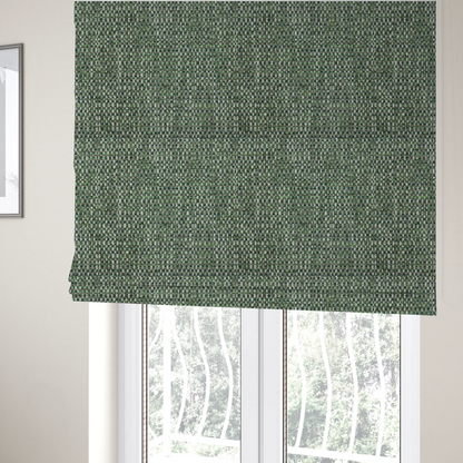 The fabric used to create these Roman blinds is a material features a dense, multi-toned green tweed pattern, intricately interlaced with small flecks of white, bright lime green, and dark brown threads throughout.