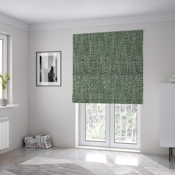 The fabric used to create these Roman blinds is a material features a dense, multi-toned green tweed pattern, intricately interlaced with small flecks of white, bright lime green, and dark brown threads throughout.