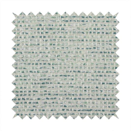 The material features a dense, multi-toned weave with a light cream or off-white background, intricately interlaced with horizontal flecks of teal, mint green, and soft grey threads throughout.
