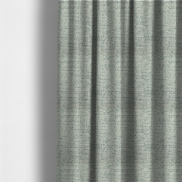 The fabric used to create these made-to-measure curtains is a  material features a dense, multi-toned weave with a light cream or off-white background, intricately interlaced with horizontal flecks of teal, mint green, and soft grey threads throughout.