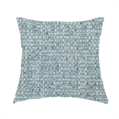 The fabric used to create these handmade cushions is a material features a dense, multi-toned weave with a soft duck egg blue and sage green base, intricately interlaced with horizontal flecks of cream and muted slate grey threads throughout.