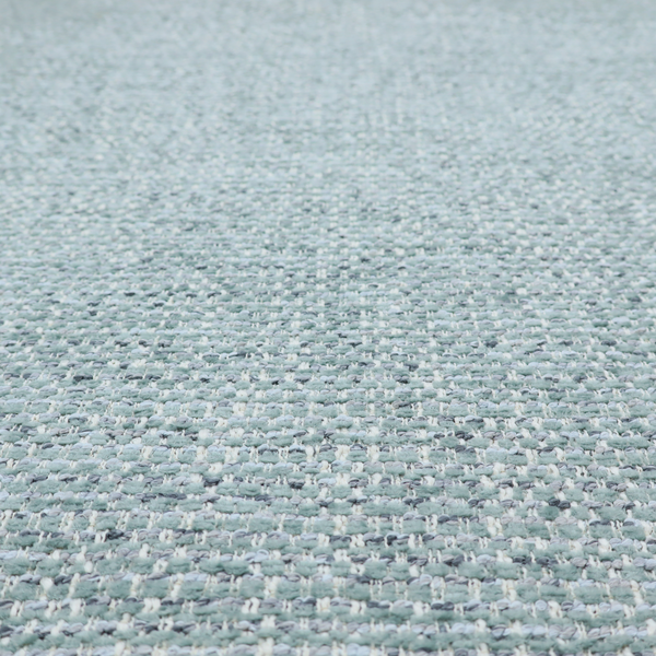 The material features a dense, multi-toned weave with a soft duck egg blue and sage green base, intricately interlaced with horizontal flecks of cream and muted slate grey threads throughout.