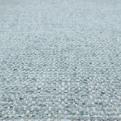 The material features a dense, multi-toned weave with a soft duck egg blue and sage green base, intricately interlaced with horizontal flecks of cream and muted slate grey threads throughout.