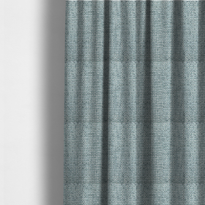 The fabric used to create these made-to-measure curtains is a material features a dense, multi-toned weave with a soft duck egg blue and sage green base, intricately interlaced with horizontal flecks of cream and muted slate grey threads throughout.