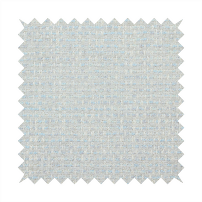 The material features a dense, light-toned weave with a pale cream and off-white base, subtly interlaced with delicate horizontal flecks of soft baby blue and light grey threads throughout.