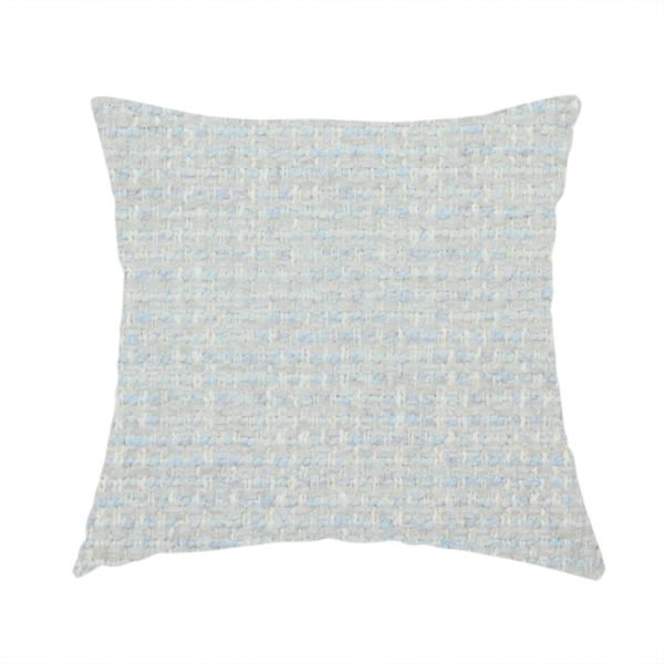 The fabric used to create this handmade cushion is a material features a dense, light-toned weave with a pale cream and off-white base, subtly interlaced with delicate horizontal flecks of soft baby blue and light grey threads throughout.