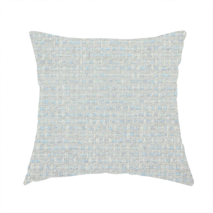 The fabric used to create this handmade cushion is a material features a dense, light-toned weave with a pale cream and off-white base, subtly interlaced with delicate horizontal flecks of soft baby blue and light grey threads throughout.