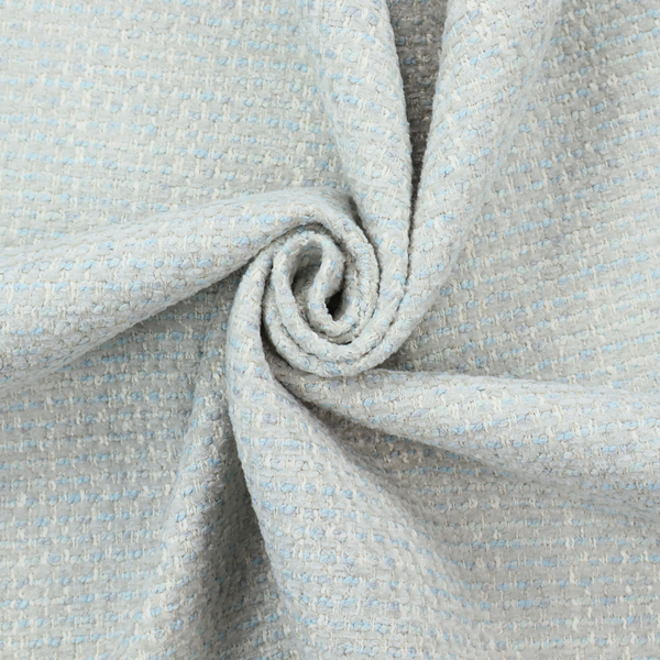 The material features a dense, light-toned weave with a pale cream and off-white base, subtly interlaced with delicate horizontal flecks of soft baby blue and light grey threads throughout.