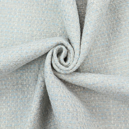The material features a dense, light-toned weave with a pale cream and off-white base, subtly interlaced with delicate horizontal flecks of soft baby blue and light grey threads throughout.