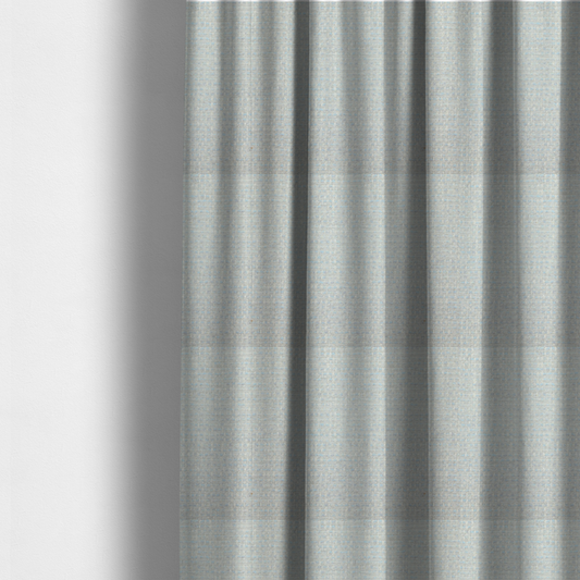 The fabric used to create these made-to-measure curtains is a material features a dense, light-toned weave with a pale cream and off-white base, subtly interlaced with delicate horizontal flecks of soft baby blue and light grey threads throughout.